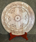 Decorative plate with Celtic flower and interlace knot design on a stand