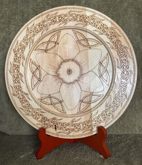 Decorative plate with Celtic flower and interlace knot design on a stand