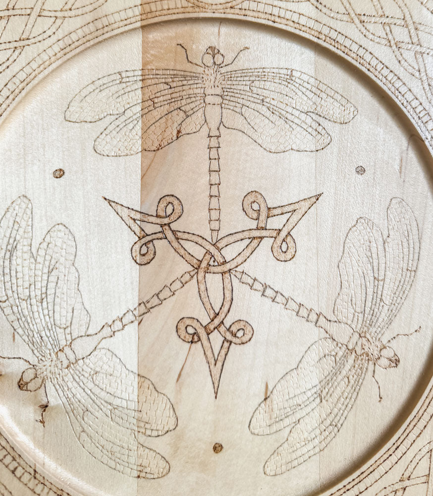 Celtic-inspired woodburned decorative plate featuring a dragonfly trio