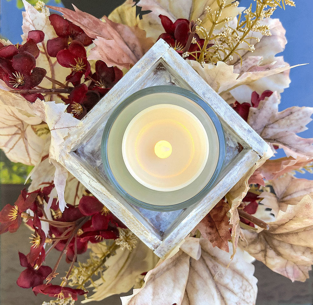 Frosty autumn handcrafted candleholder with artificial burgundy flowers