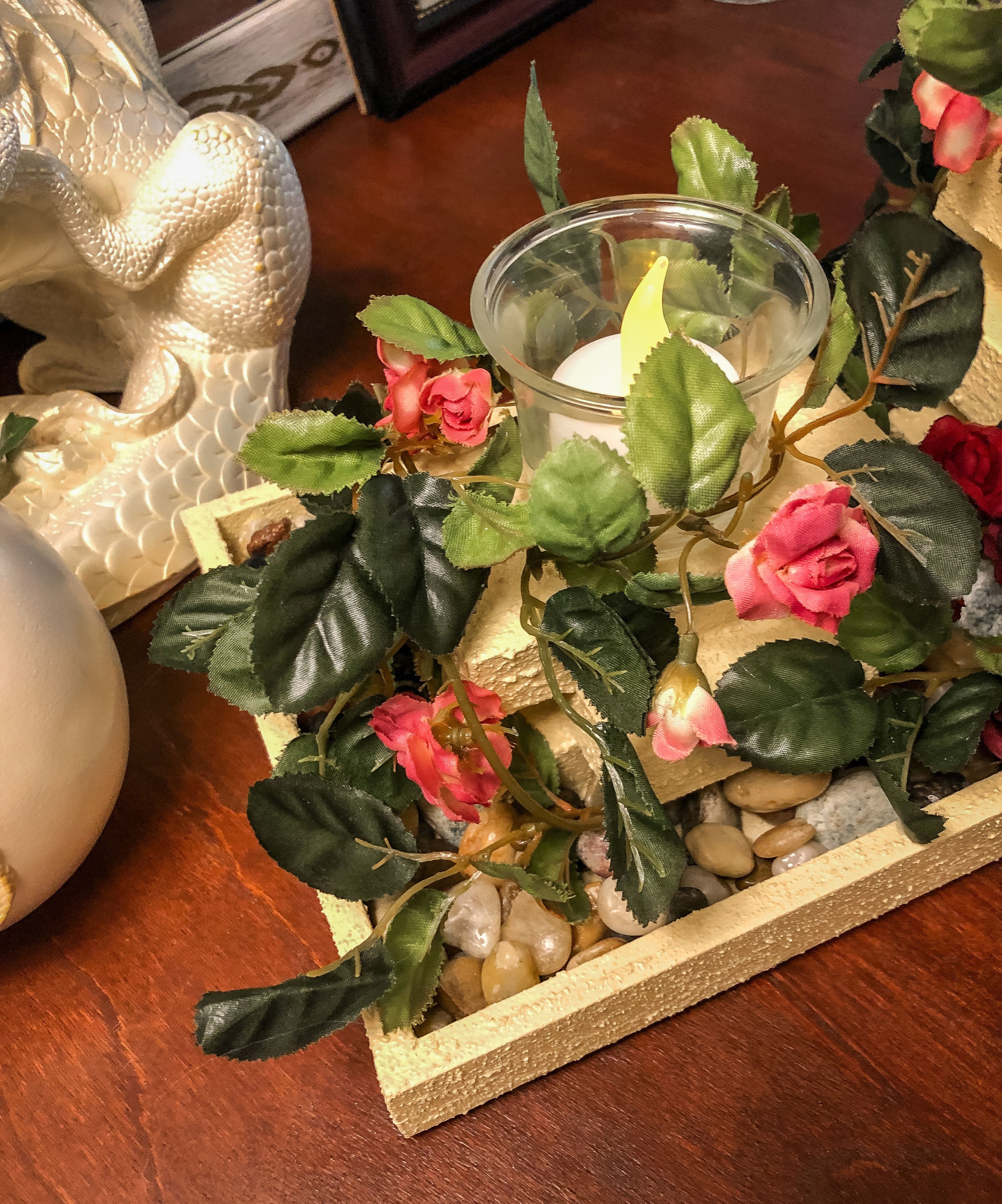 Wood candleholder with three garden pillars covered with miniature pink roses