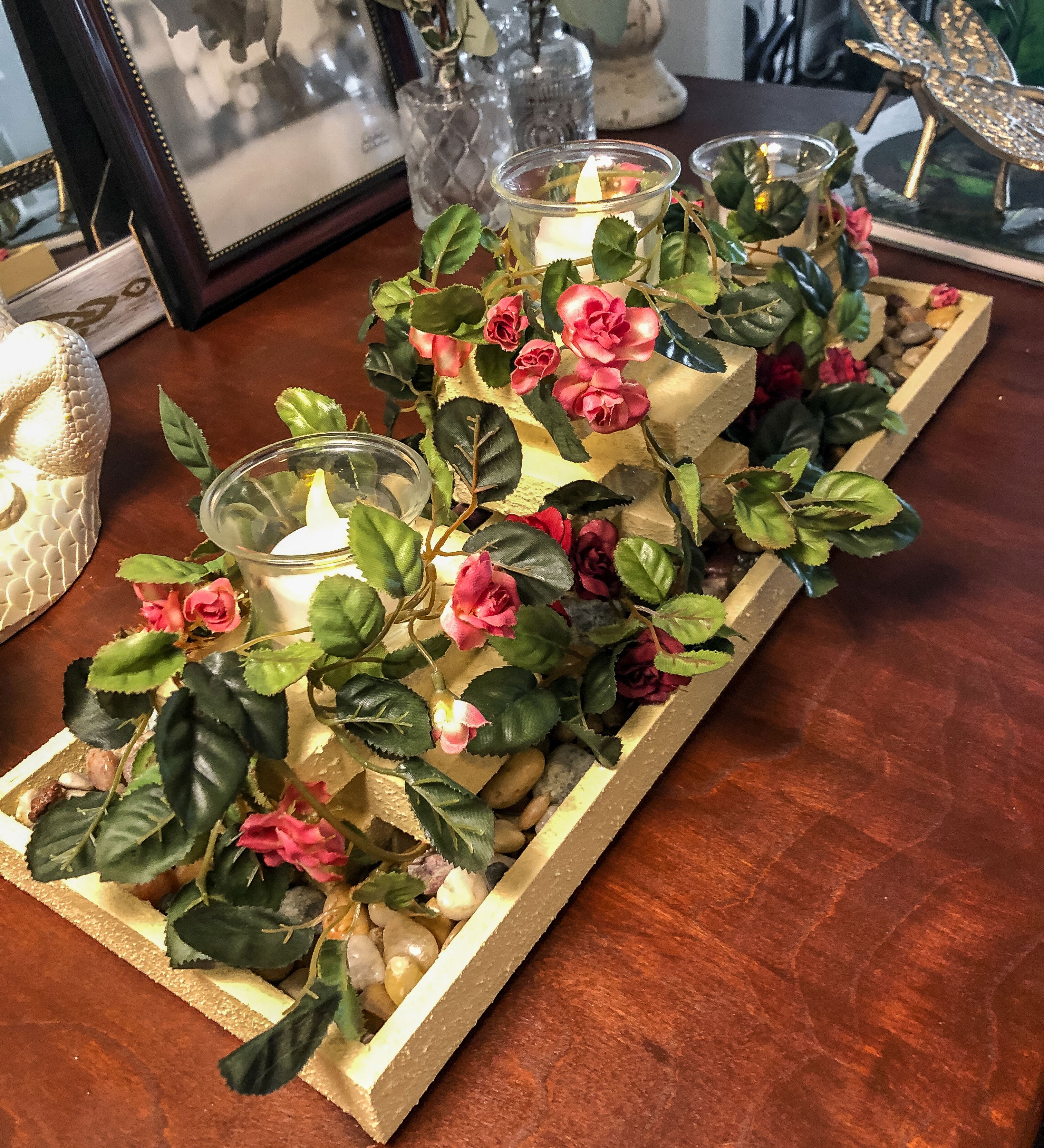 Wood candleholder with three garden pillars covered with miniature pink roses