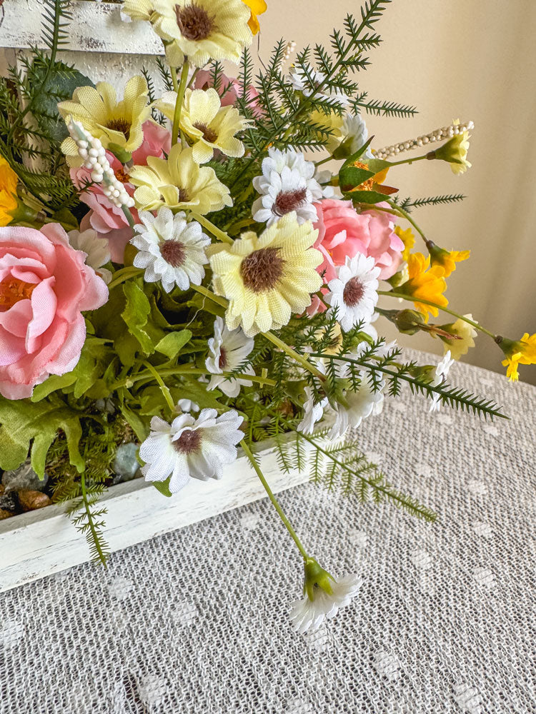 Wood candleholder with a miniature fairy tower in a flower bush