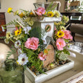 Fairy themed candleholder with miniature faux florals in a tray