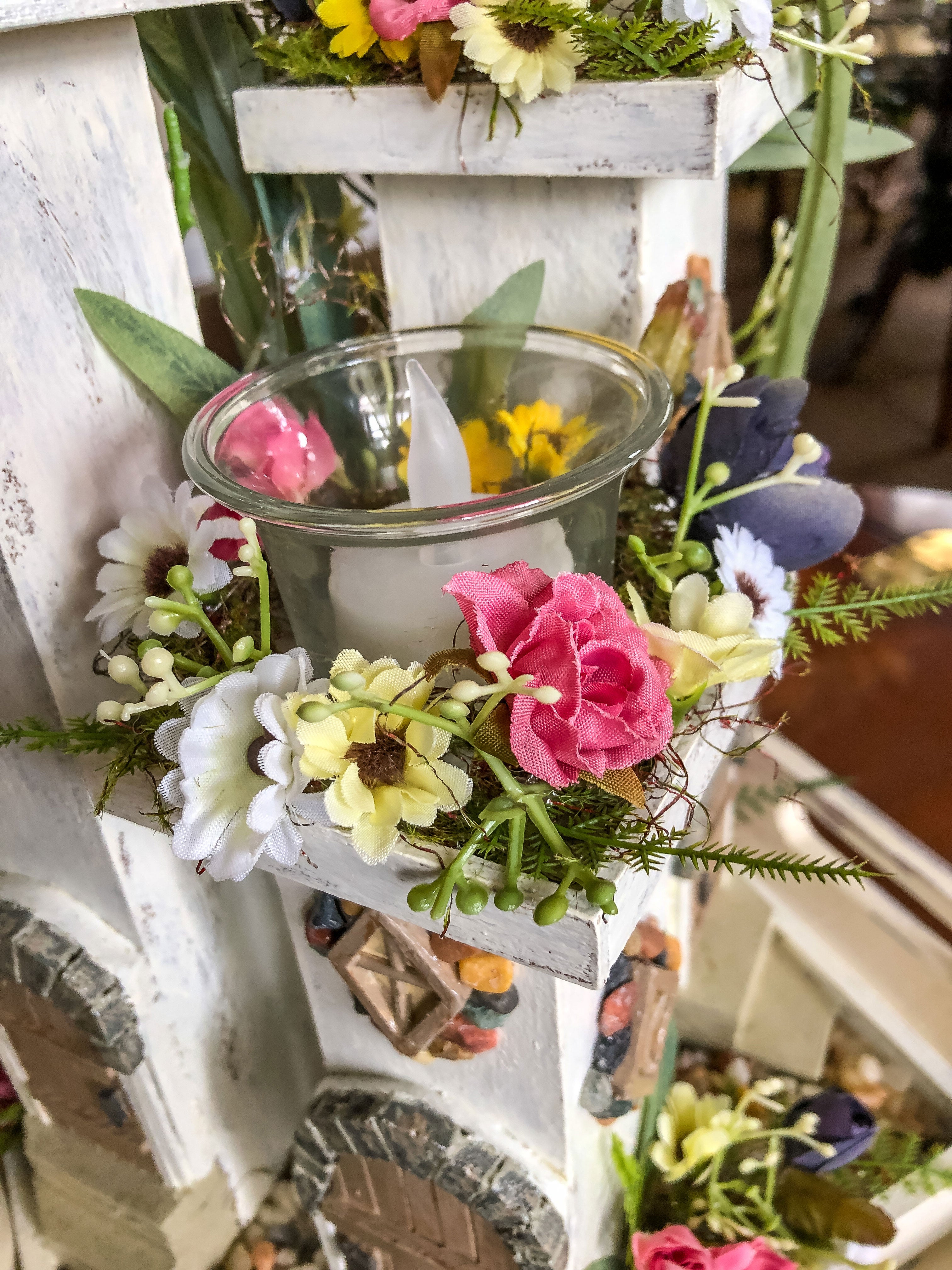 Whimsical wood candleholder with a fairy tower trio and faux florals
