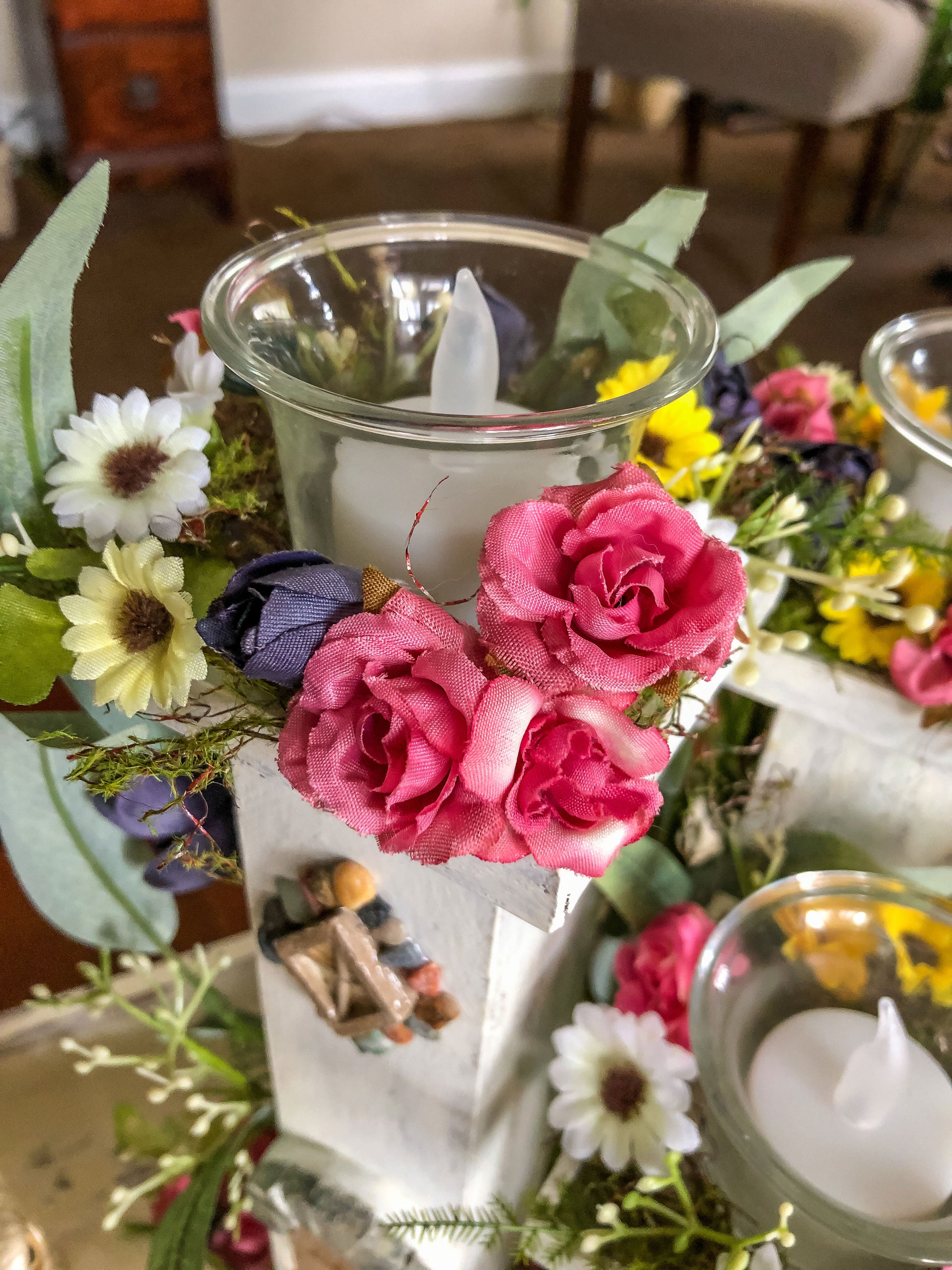 Whimsical wood candleholder with a fairy tower trio and faux florals