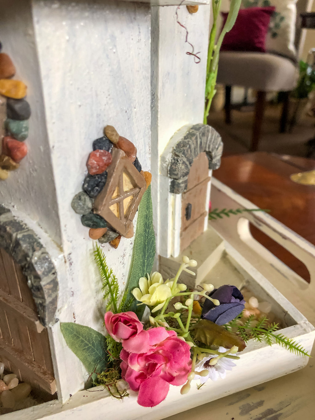 Whimsical wood candleholder with a fairy tower trio and faux florals