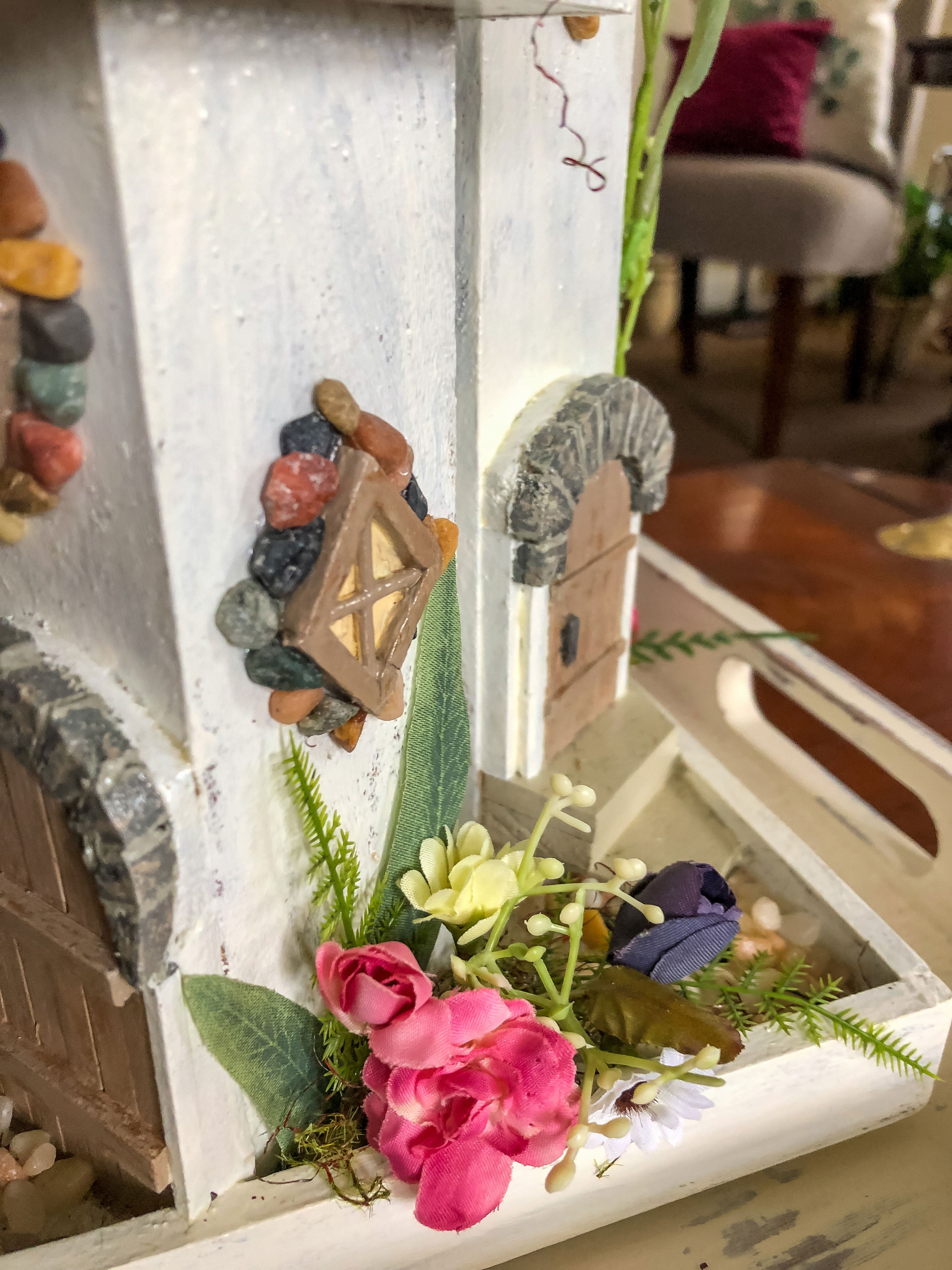 Whimsical wood candleholder with a fairy tower trio and faux florals