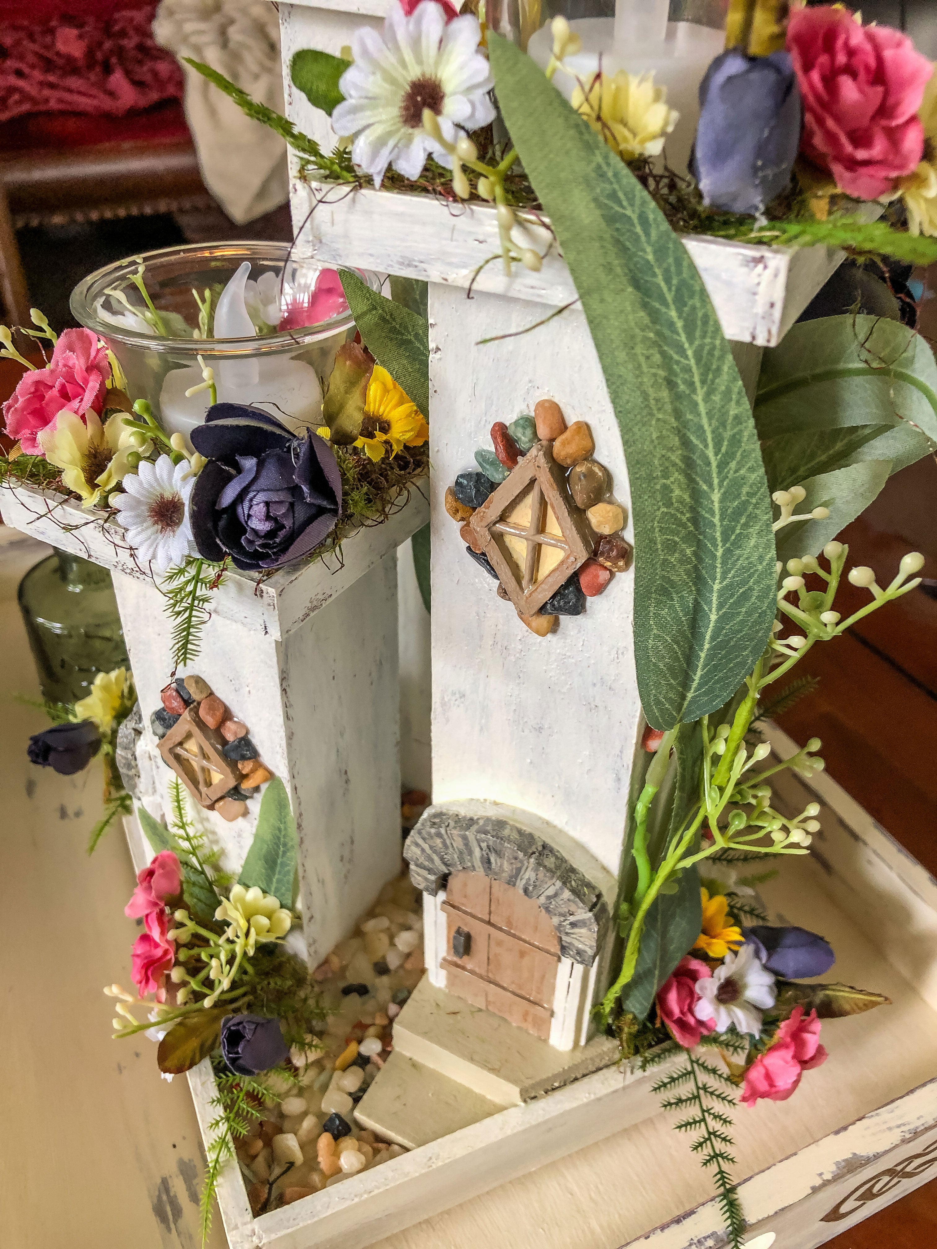 Whimsical wood candleholder with a fairy tower trio and faux florals