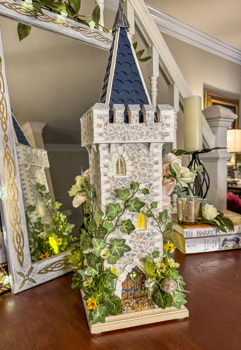 Handcrafted wood and stone fairy castle with faux florals