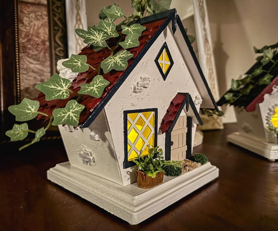 Red, white, and blue woodland fairy cottage with drop gable