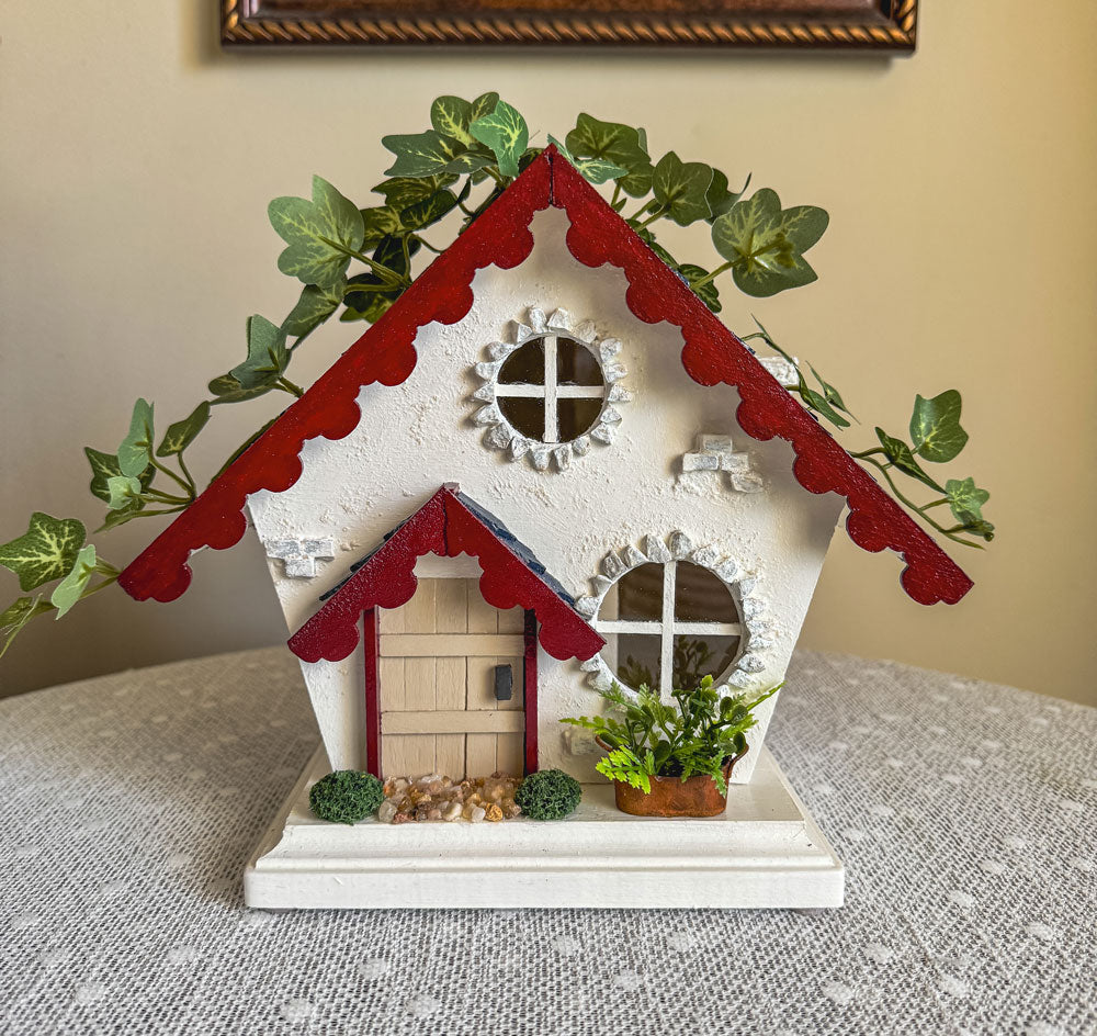 Red, white, and blue woodland fairy cottage with scalloped roof trim