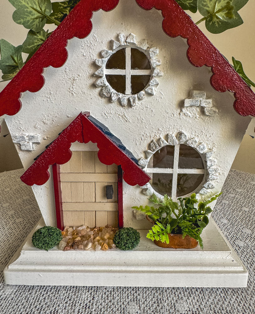 Red, white, and blue woodland fairy cottage with scalloped roof trim