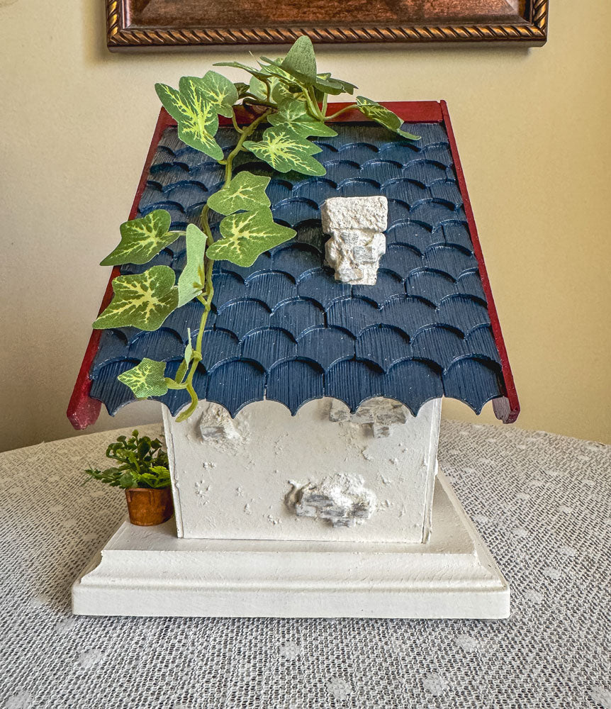 Red, white, and blue woodland fairy cottage with scalloped roof trim