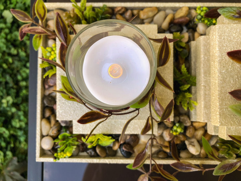 Garden-thermed votive candleholder with three stacked pillars