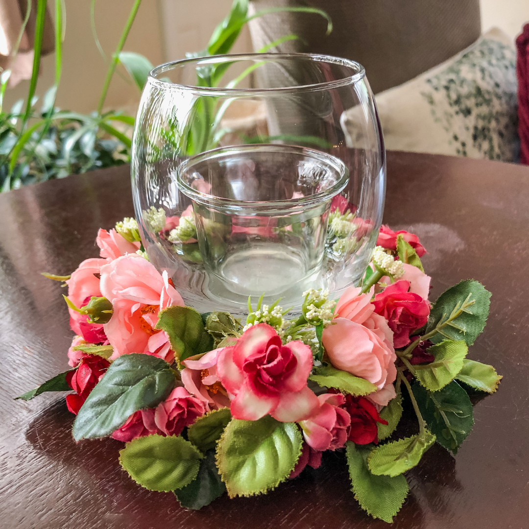 Votive candle holder with miniature red and pink faux floral ring