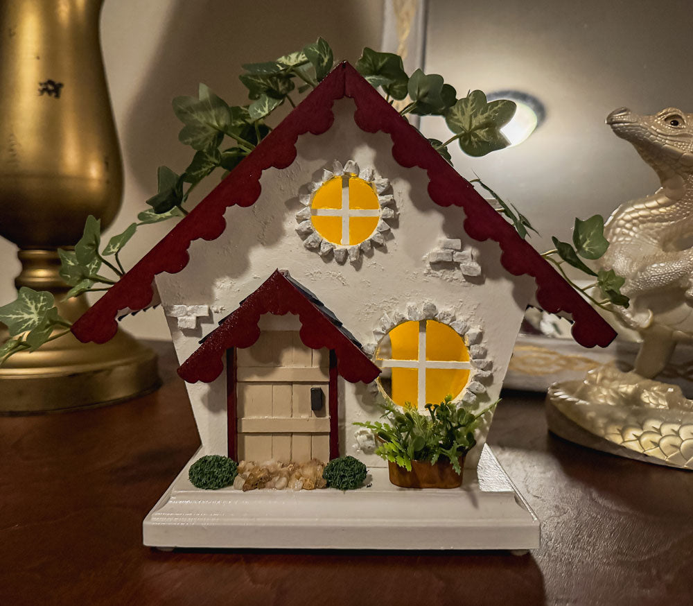 Red, white, and blue woodland fairy cottage with scalloped roof trim