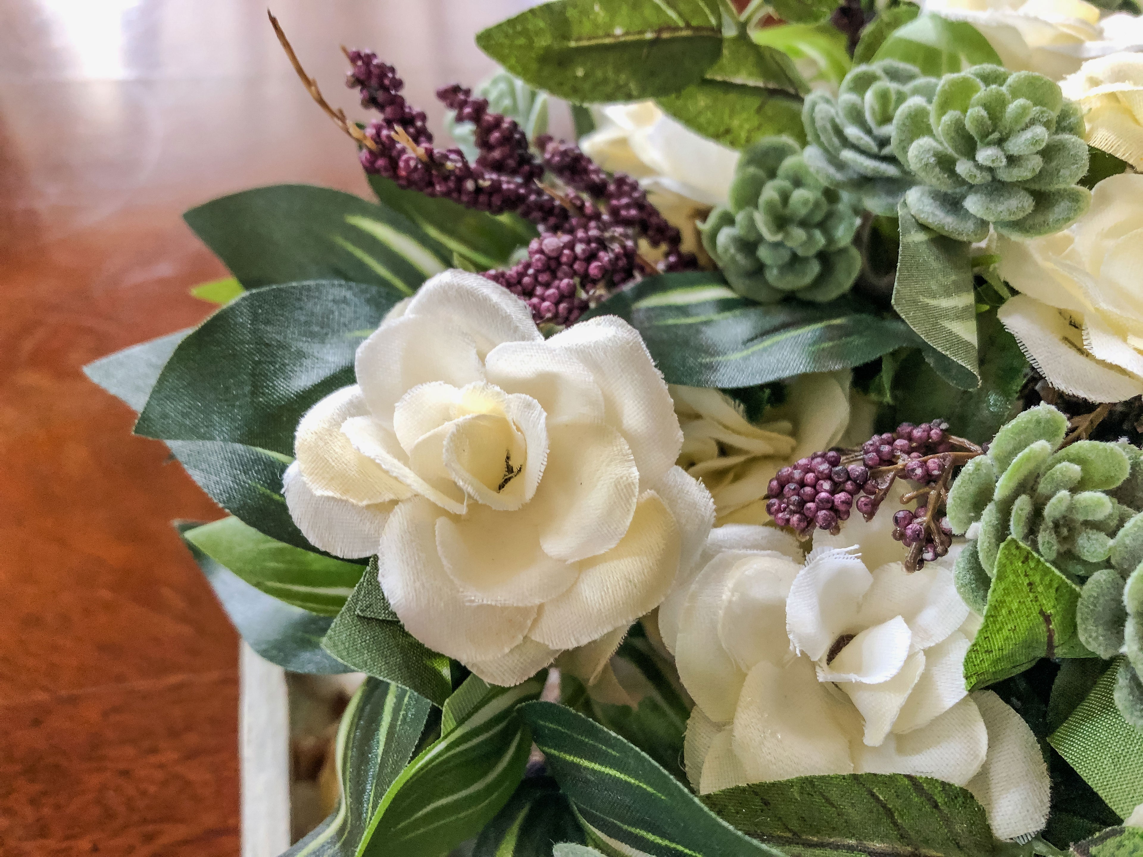 Fairy-inspired faux floral arrangement with faux roses and purple berries