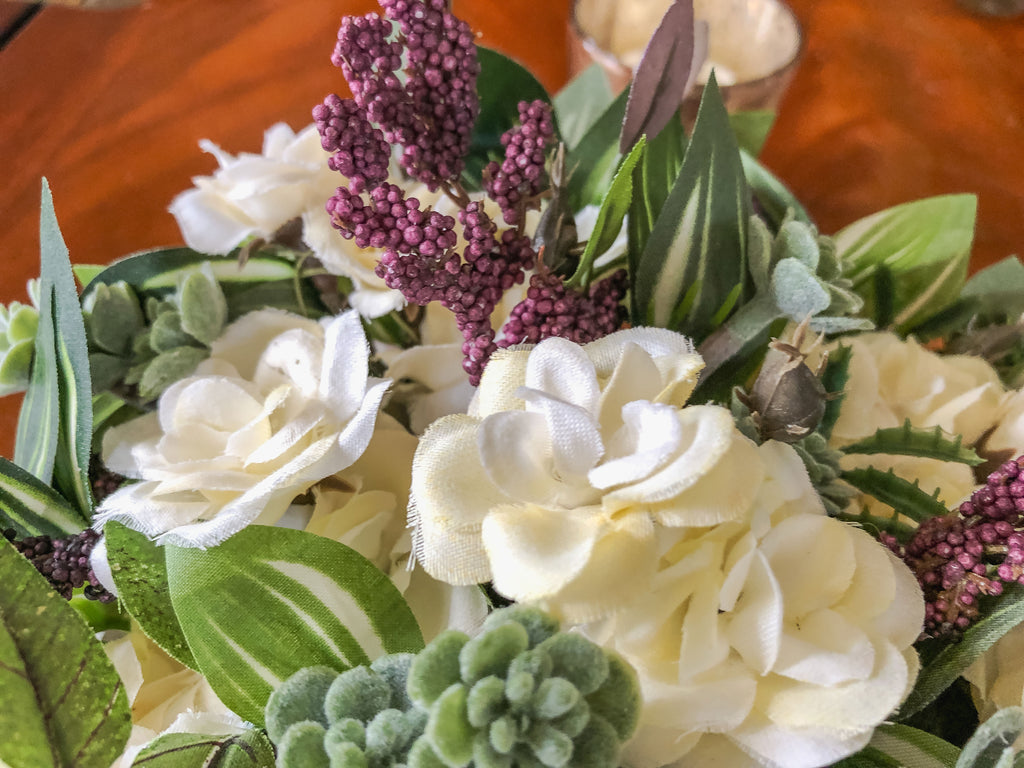 Fairy-inspired faux floral arrangement with faux roses and purple berries
