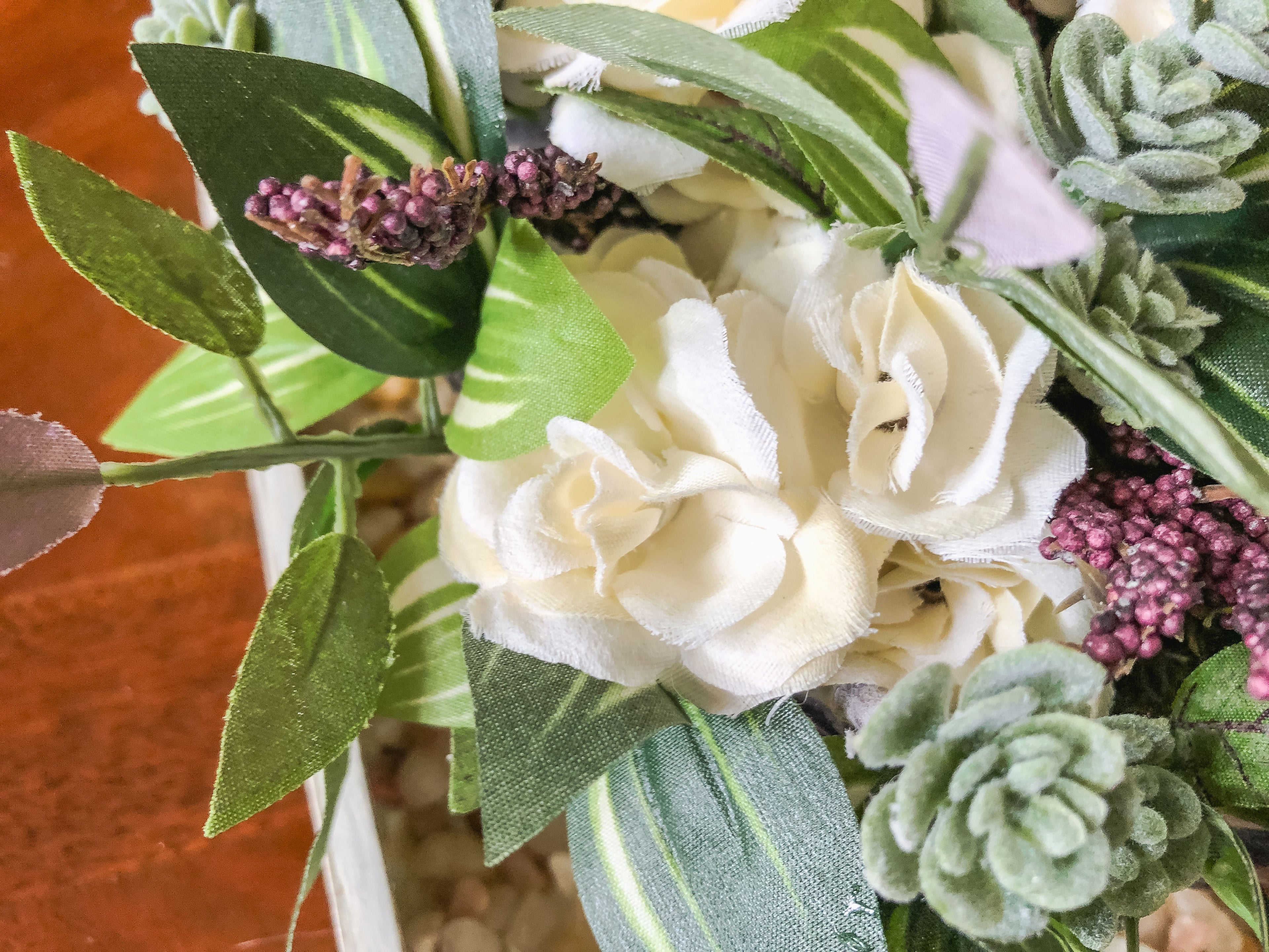 Fairy-inspired faux floral arrangement with faux roses and purple berries