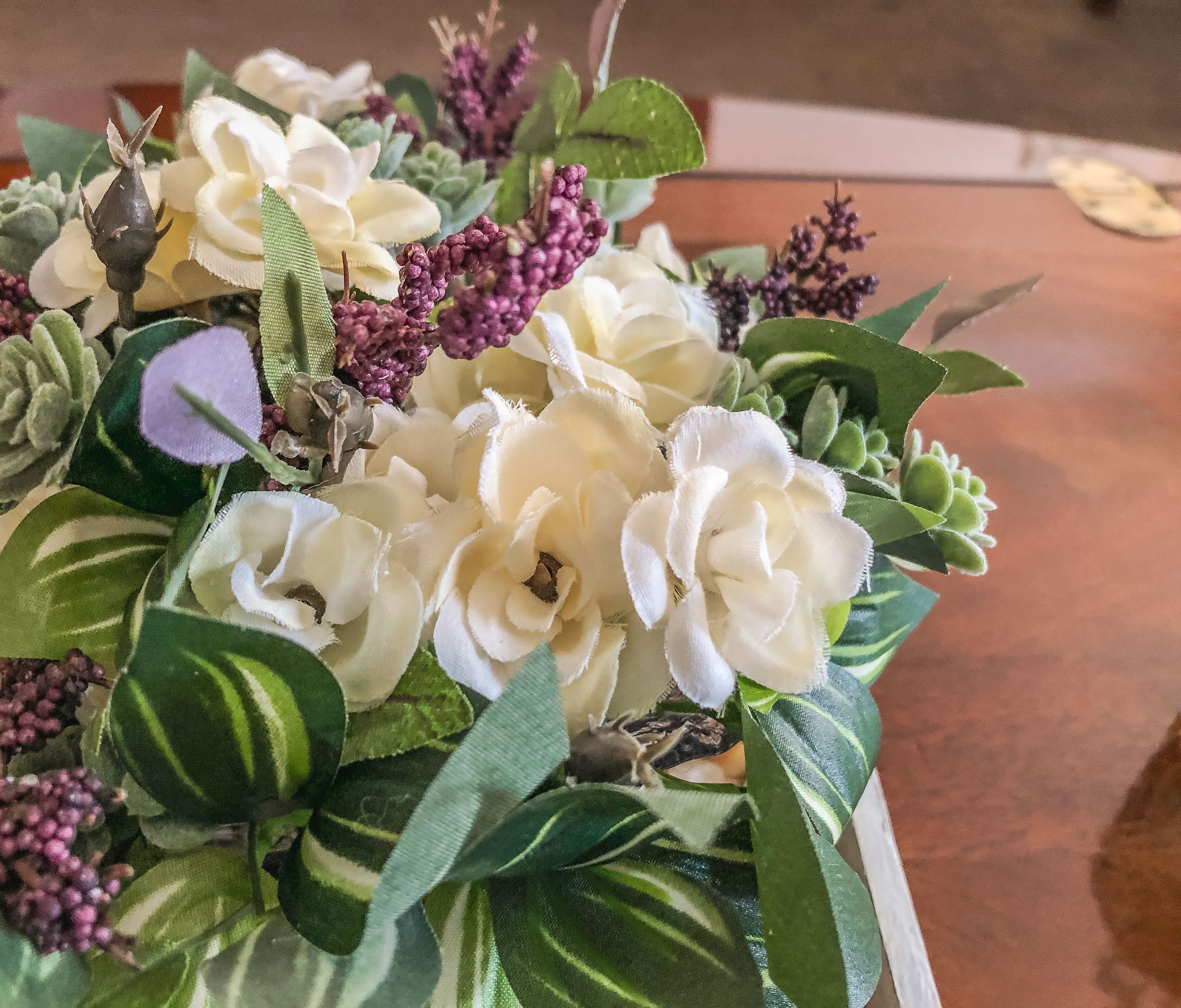Fairy-inspired faux floral arrangement with faux roses and purple berries