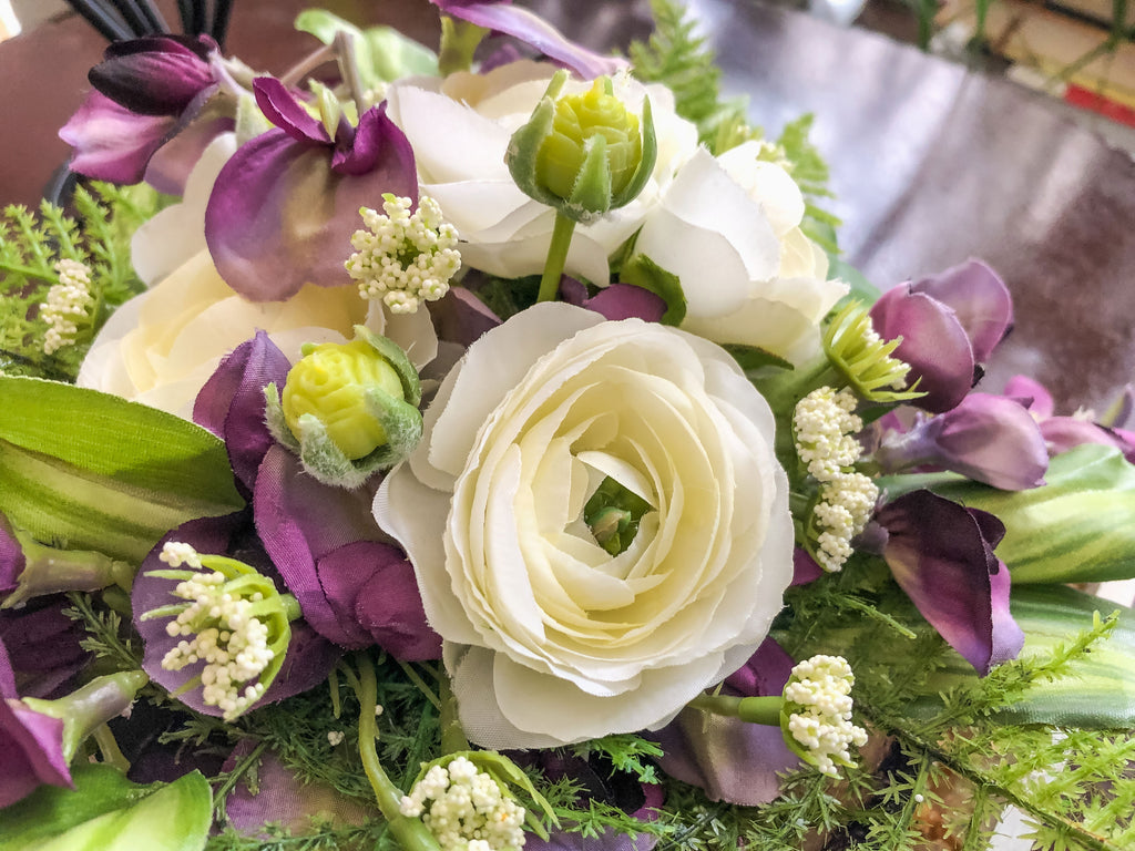 Fairy-inspired faux floral arrangement with purple wisteria