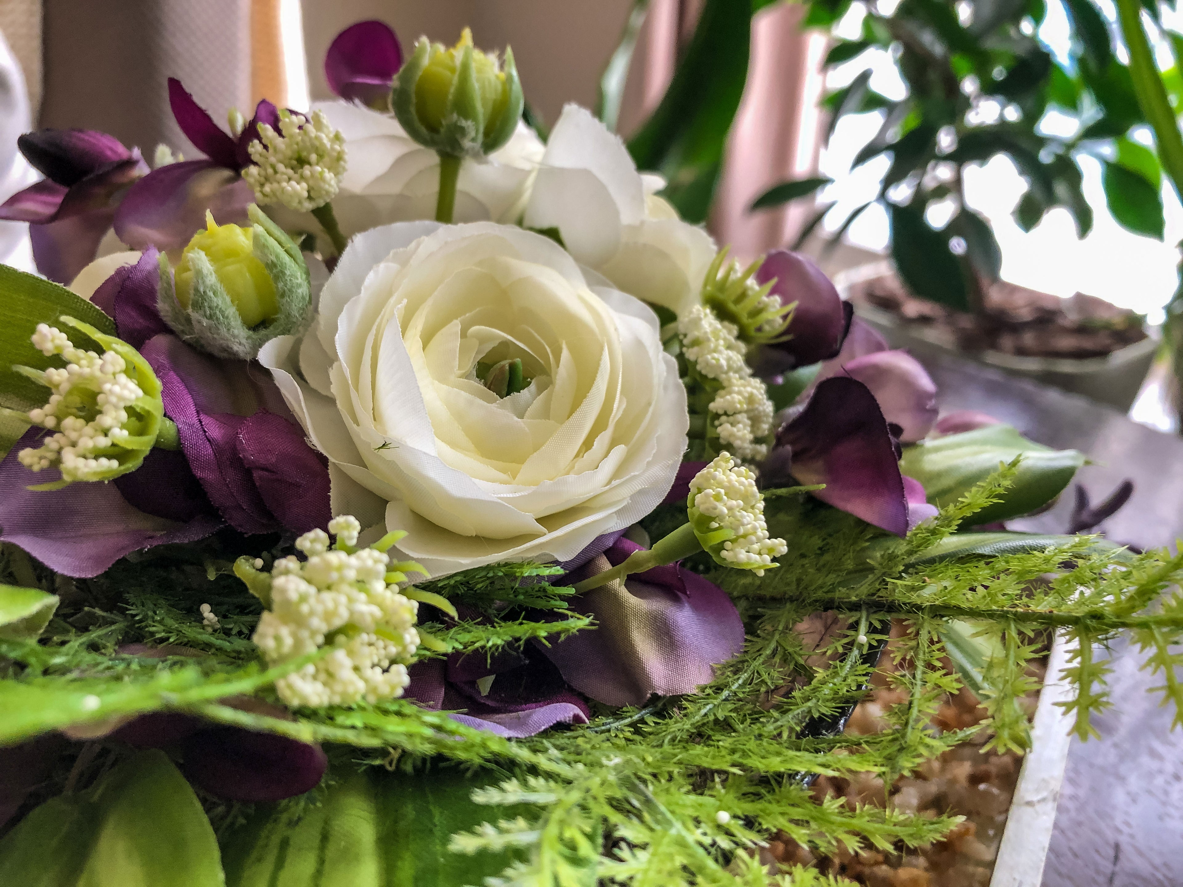 Fairy-inspired faux floral arrangement with purple wisteria