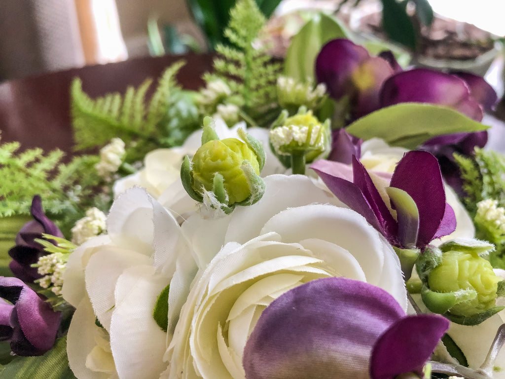 Fairy-inspired faux floral arrangement with purple wisteria